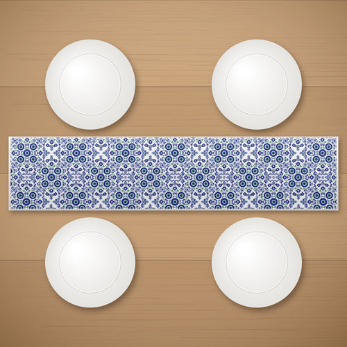 Garden table runner on a wooden table with plates