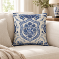 Heritage cushion in cobalt blue and cream folk print on a cream sofa